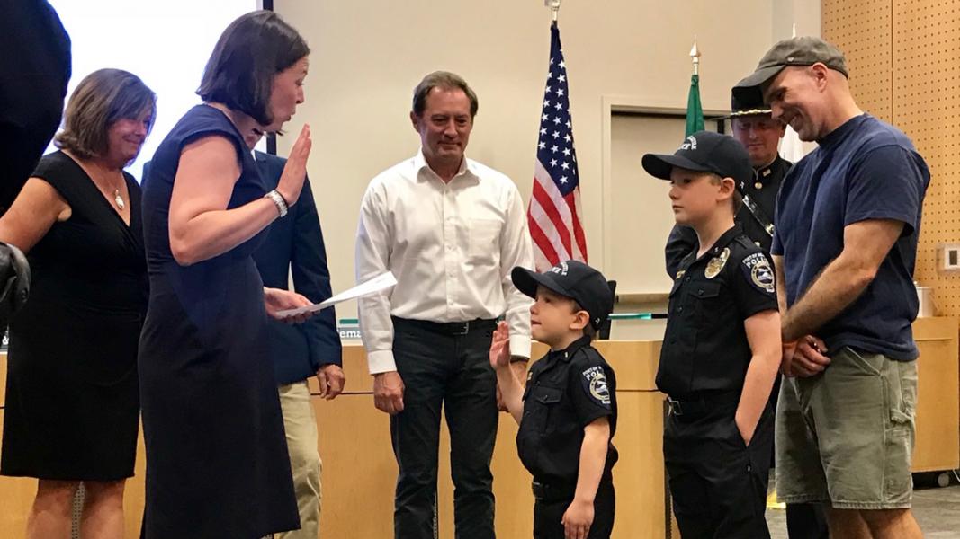 Commissioners swear in youth at the Officer for a Day ceremony