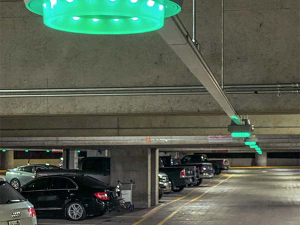 Green lights installed above parking stalls indicating open spots at SEA Airport garage