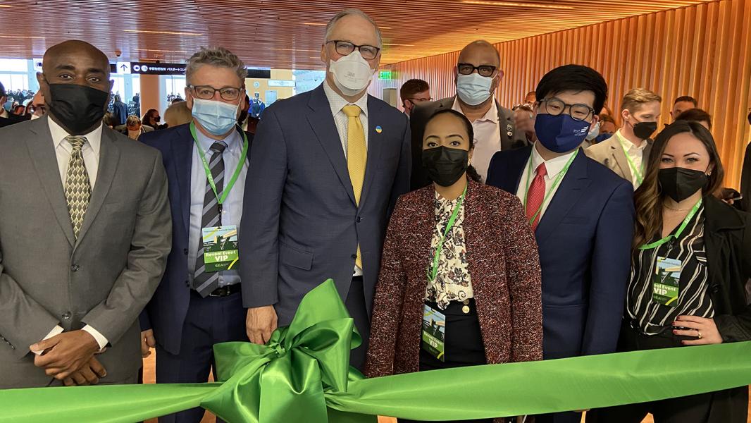 State and local leaders including Governor Inslee cut a green ribbon to celebrate the reveal of the Internation Arrivals Facility