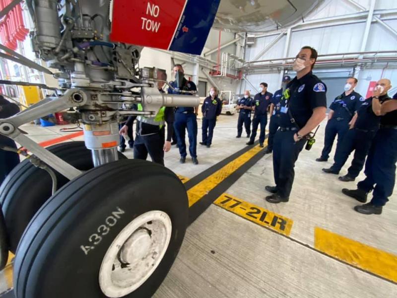 firefighters look at airbus