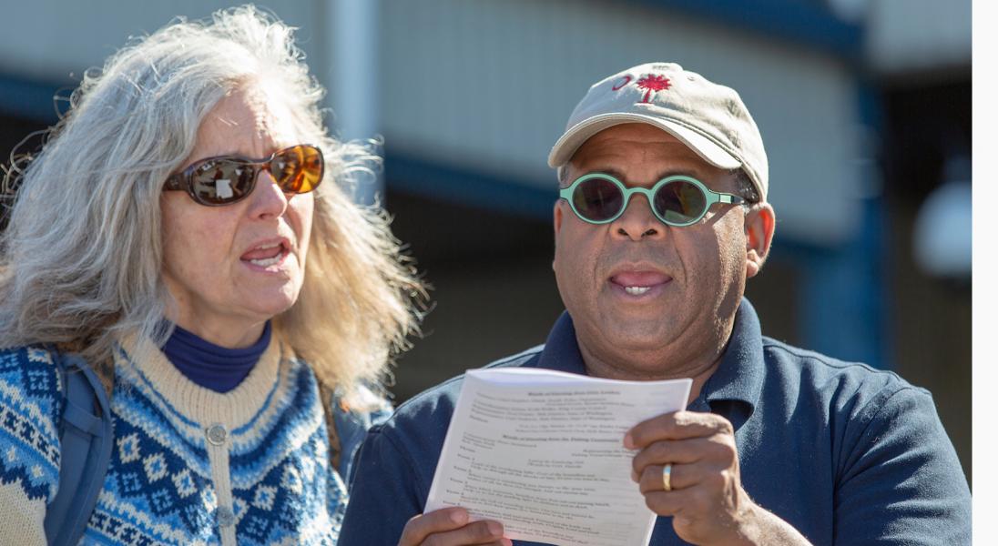 Blessing of the Fleet attendees sing a hymn during the service. March 17, 2019, Fishermen's Terminal, Seattle, WA