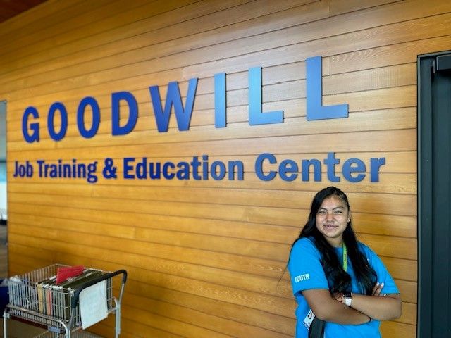 Ceyla in front of the Seattle Goodwill building