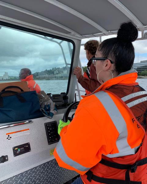 Faith driving a boat 