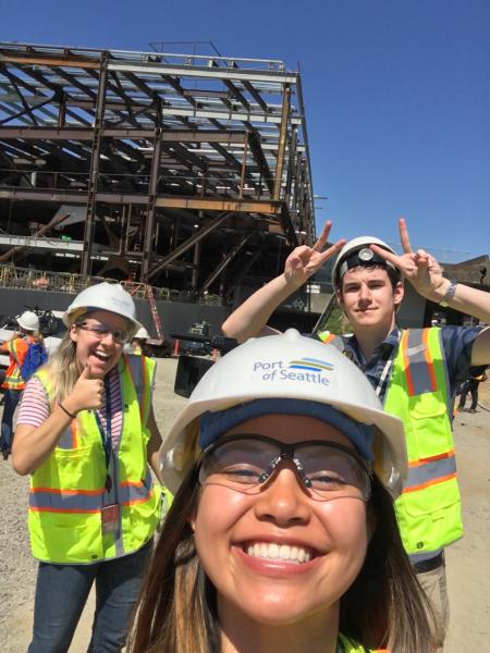 Interns in front of a jet