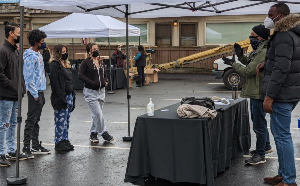 Students standing under a tent at a 2020 event