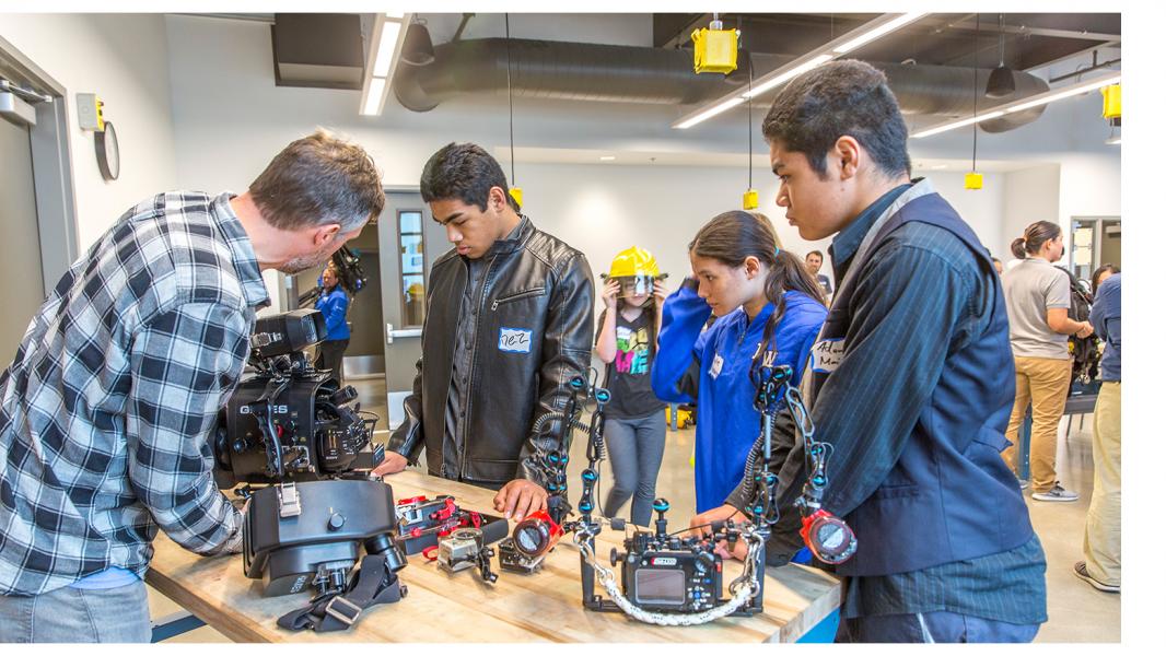 Youth stop at a demonstration table at the Maritime Collaborative Learning event, April, 2018, Seattle