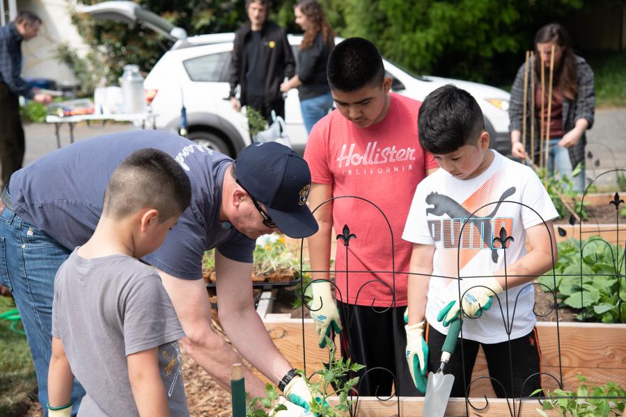 Kids work in Midway Park Community Garden.