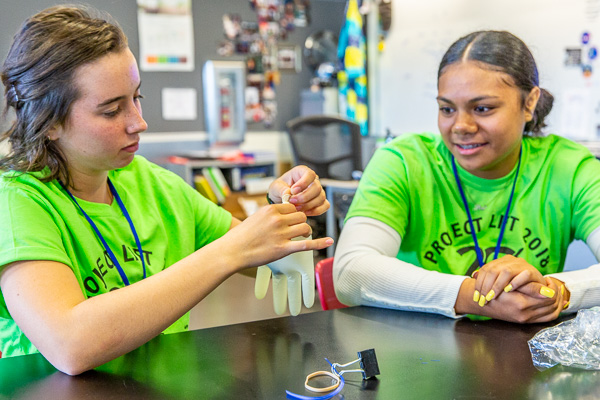 Two female students try an aviation experiment