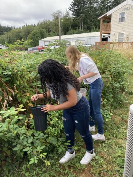 Anne-Nasha and Elizabeth in the garden plot