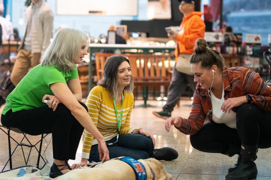 Gracie and Joanne interact with passengers.