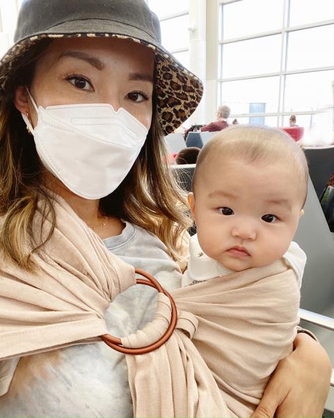 Angela and her six-month-old baby at SEA.