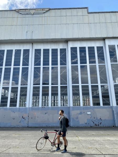 A photo of Andrew Hoge with a bike